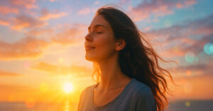 Young woman taking in the sun from a rainbow colored sky.